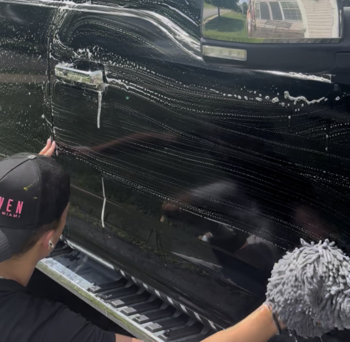 Willy hand washing an F-150 door